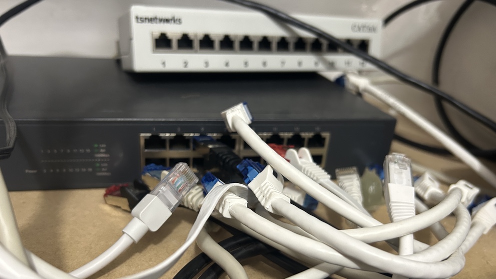 Messy Ethernet cables and network switches and patch